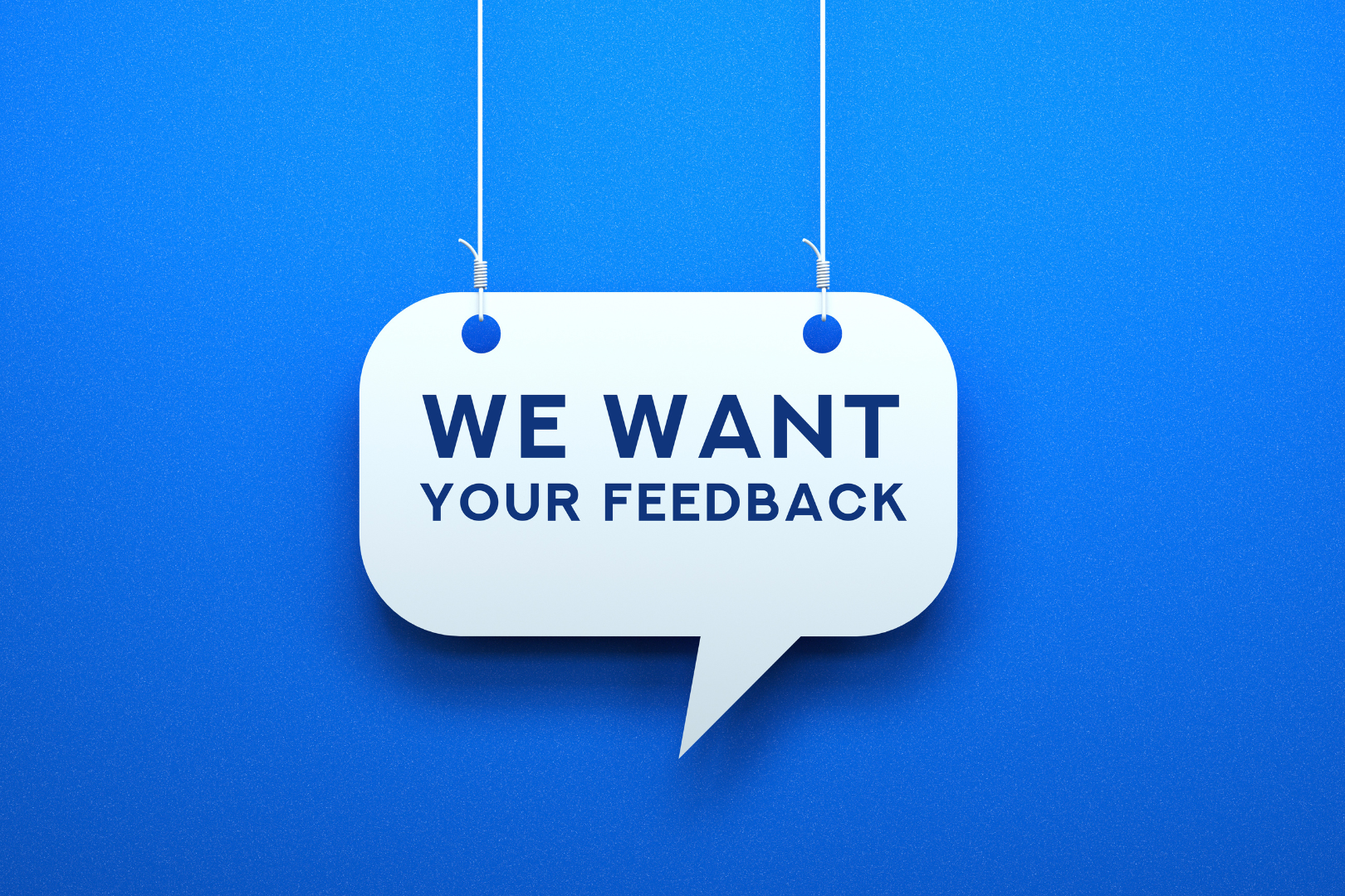 feedback sign hanging on a wire