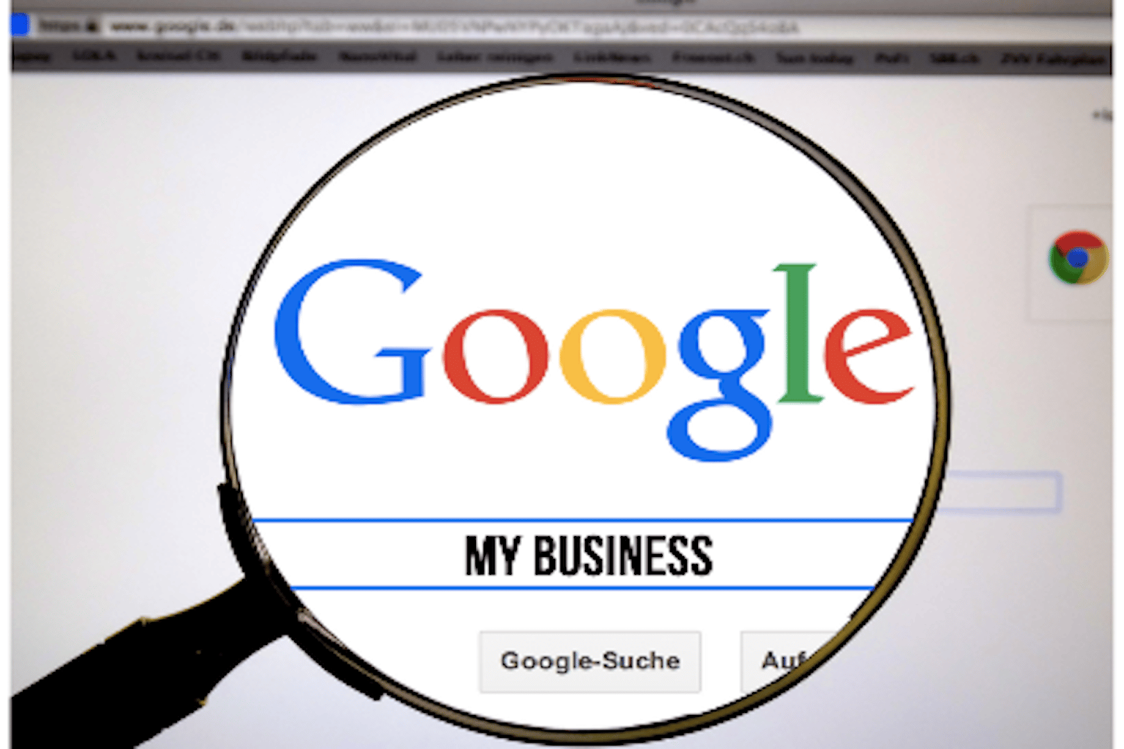 magnifying glass over google website